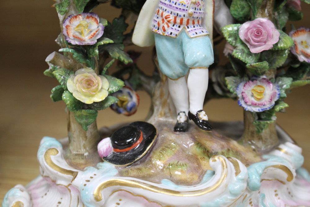 A pair of Meissen figural candlesticks, late 19th century, H.12cm